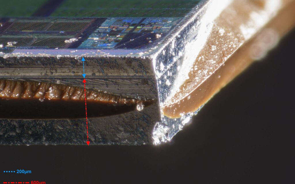 Polished edge of a 28 nm chip die under magnification
